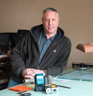 photo of a man sitting at a desk